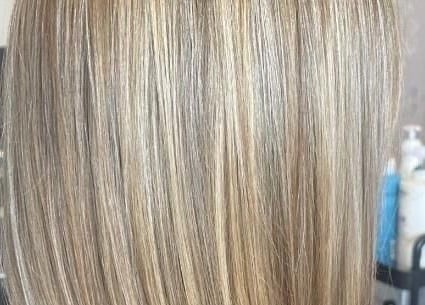 Smooth blonde hair treatment at Salon Seven, Wivenhoe, England, GB, showcasing silky highlights.