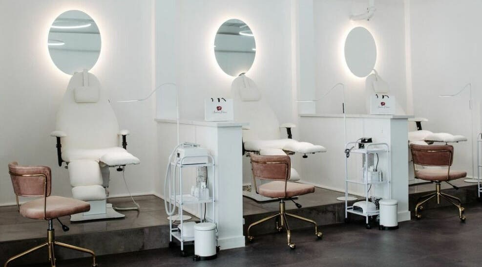 Elegant treatment stations at Amelina Paraiso, Des Plaines, Illinois, US with plush chairs and bright lighting.