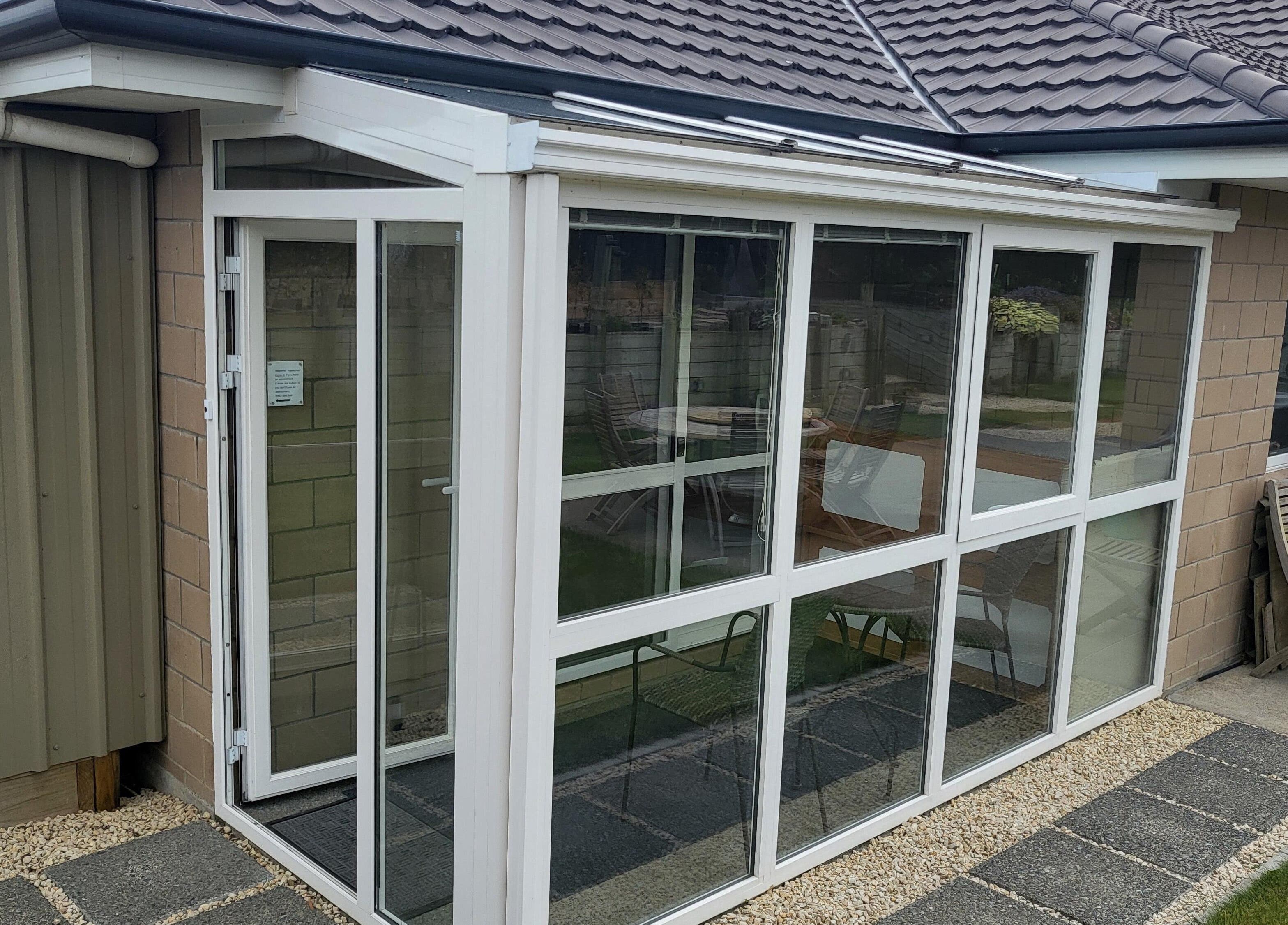 Spacious conservatory at Dr Derek Patton's venue, Amberley, North Canterbury, NZ, showcasing modern design.