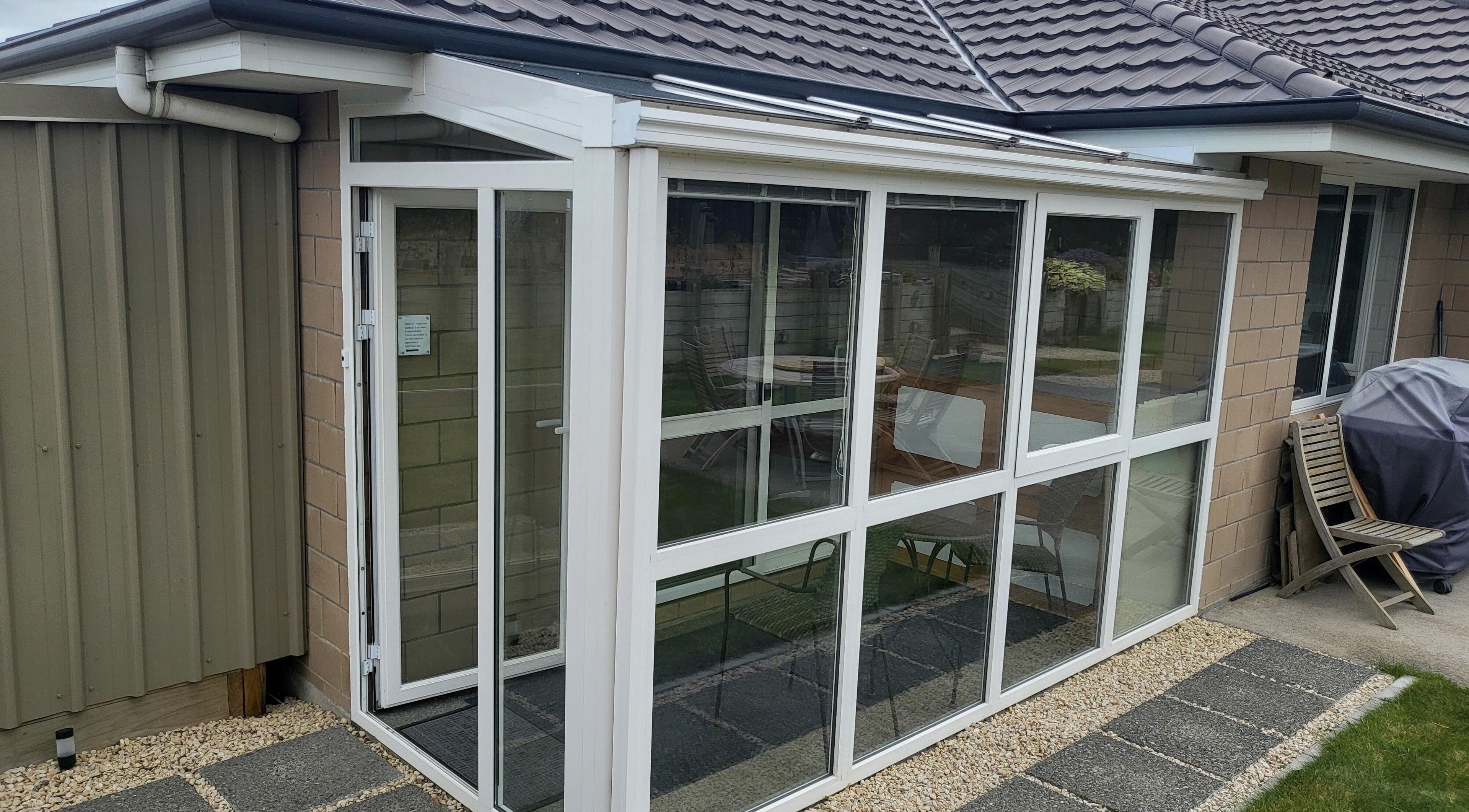 Spacious conservatory at Dr Derek Patton's venue, Amberley, North Canterbury, NZ, showcasing modern design.