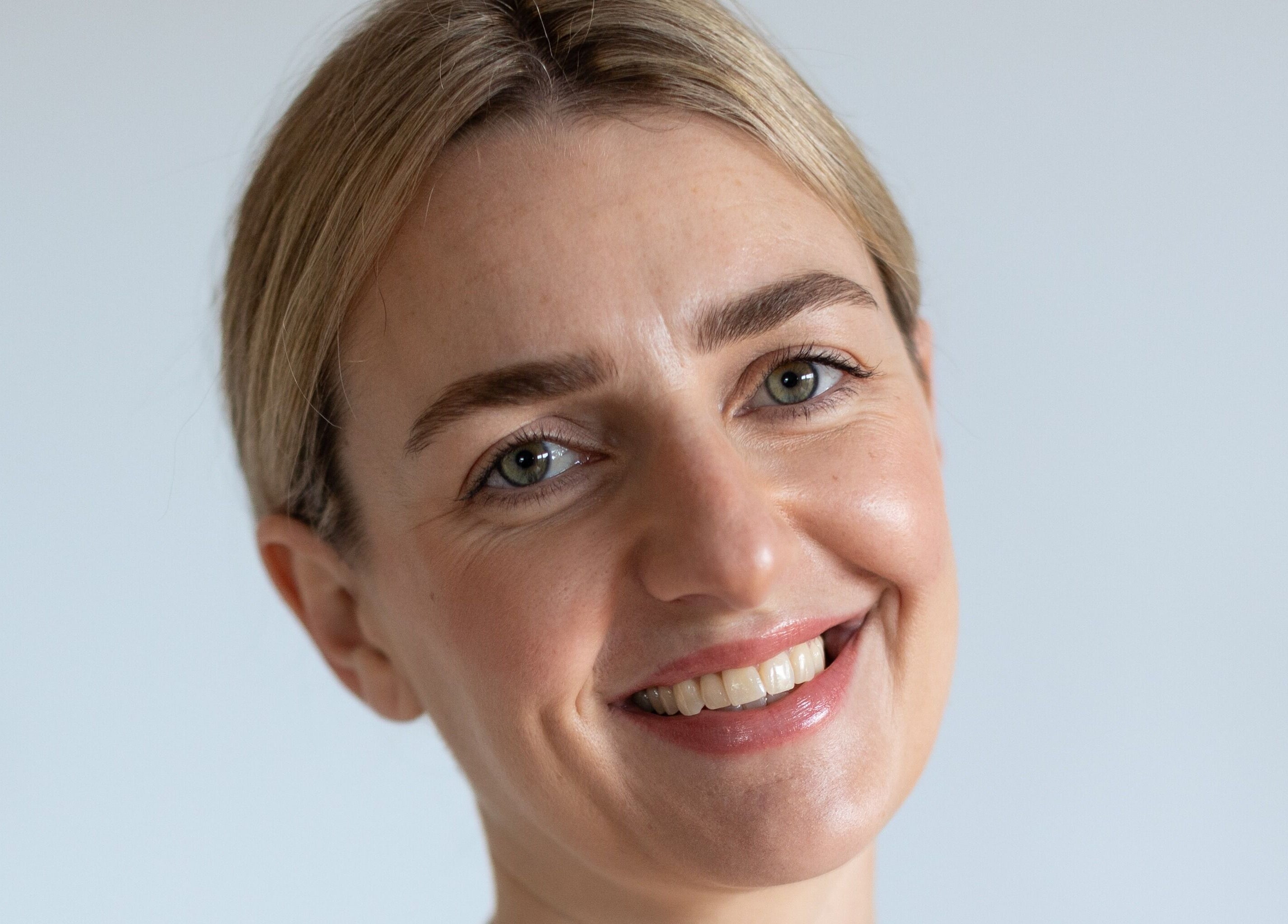 Smiling person enjoying skincare at The Face and Body Clinic, Elgin, Scotland, GB.