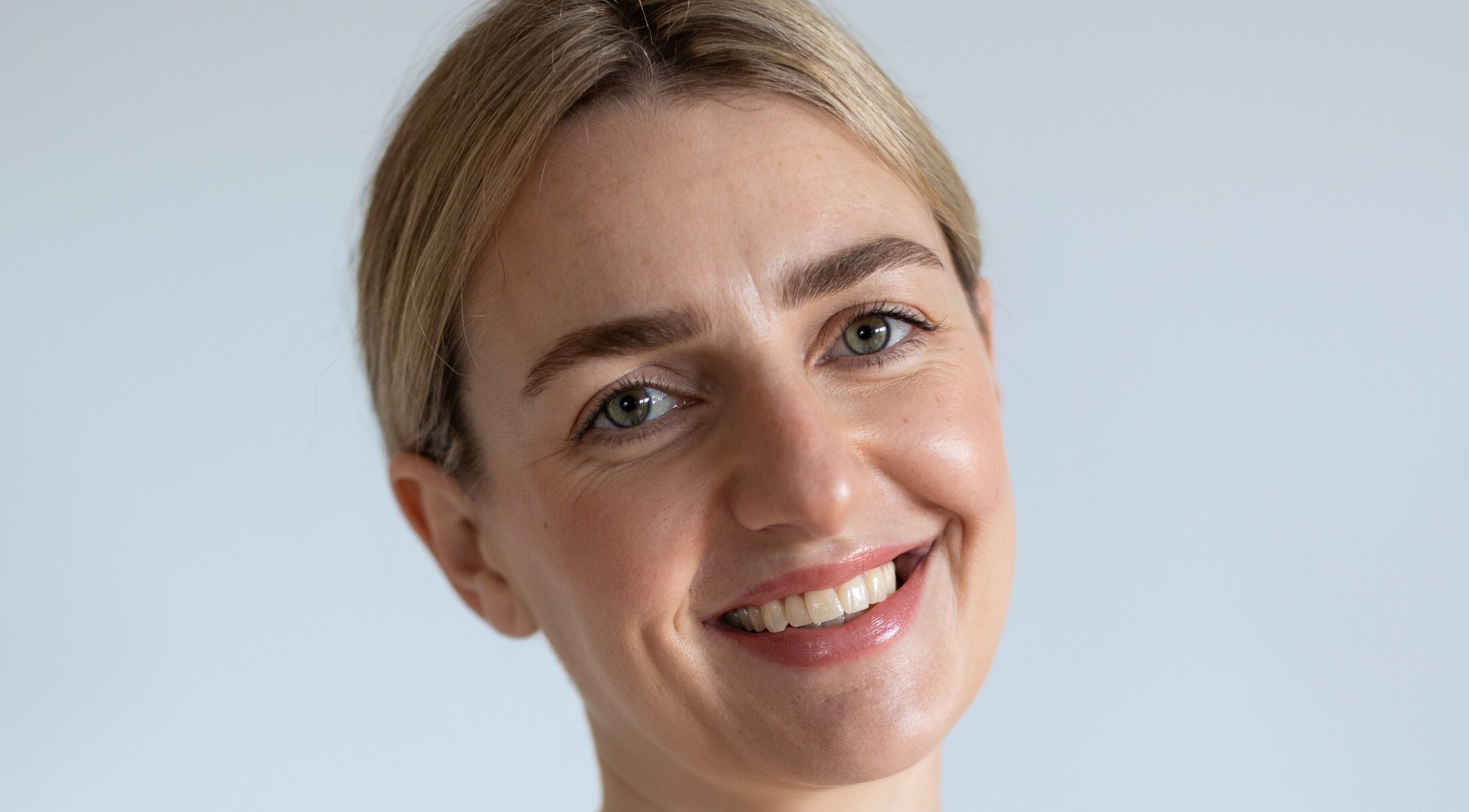 Smiling person enjoying skincare at The Face and Body Clinic, Elgin, Scotland, GB.
