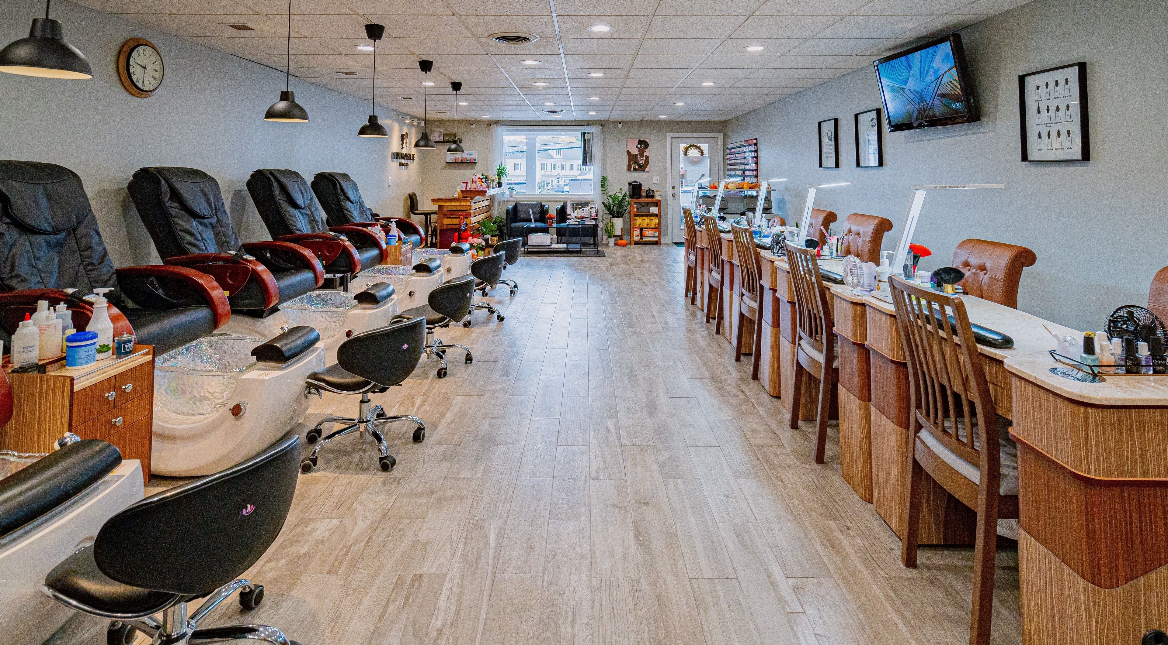 Interior of Mademoiselle Nails and Spa - Northborough featuring luxury nail stations in Northborough, Massachusetts, US.