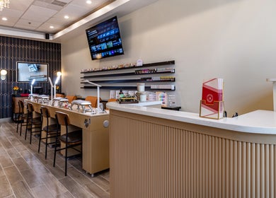 Modern interior of Mademoiselle Nails & Spa - Worcester in Worcester, Massachusetts, US, featuring nail stations.