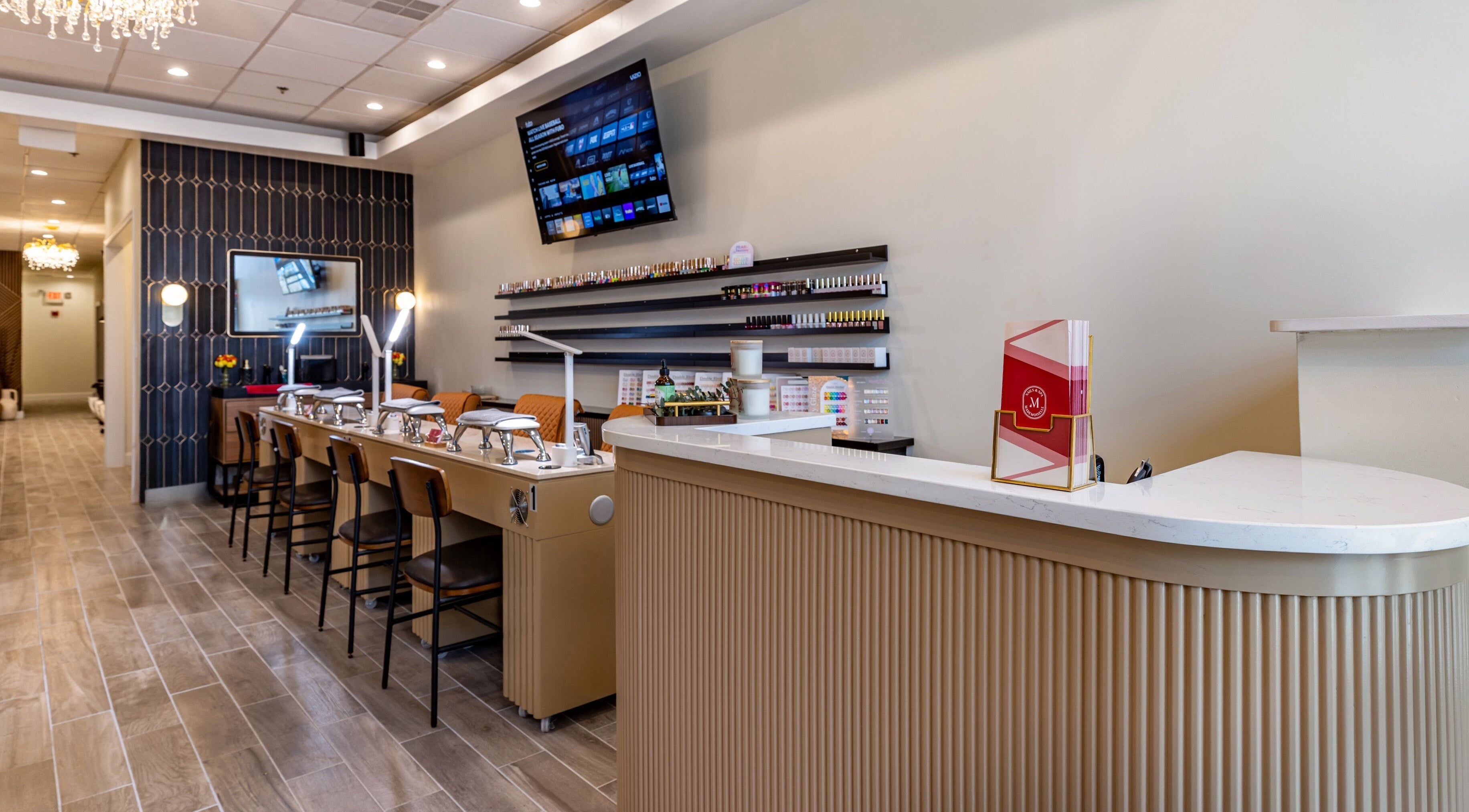 Modern interior of Mademoiselle Nails & Spa - Worcester in Worcester, Massachusetts, US, featuring nail stations.