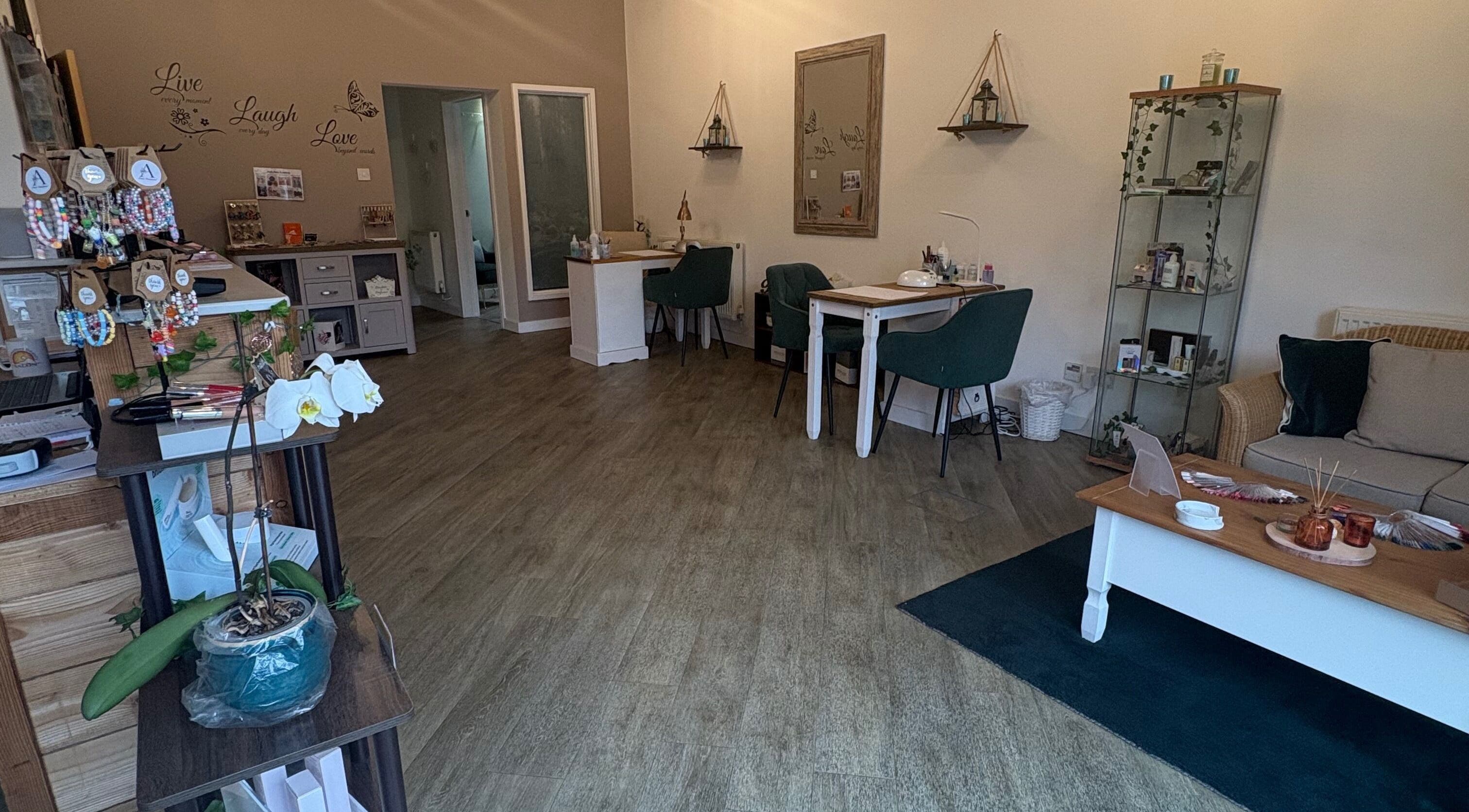 Interior of Midsomer Beauty Salon Ltd, Chilcompton, England, GB, showcasing a cozy and elegant salon space.