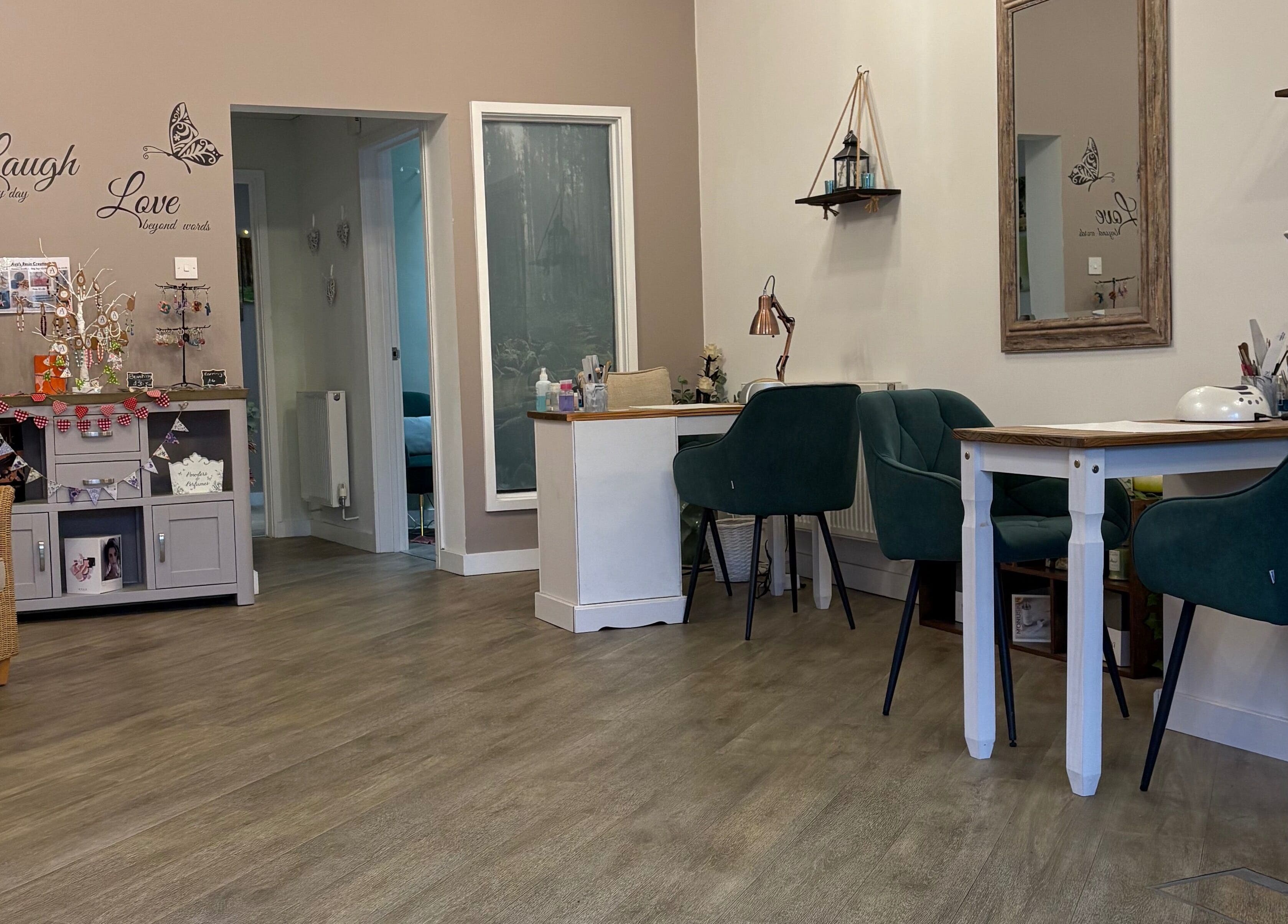 Elegant interior of Midsomer Beauty Salon Ltd in Chilcompton, England, GB, showcasing comfortable seating and decor.