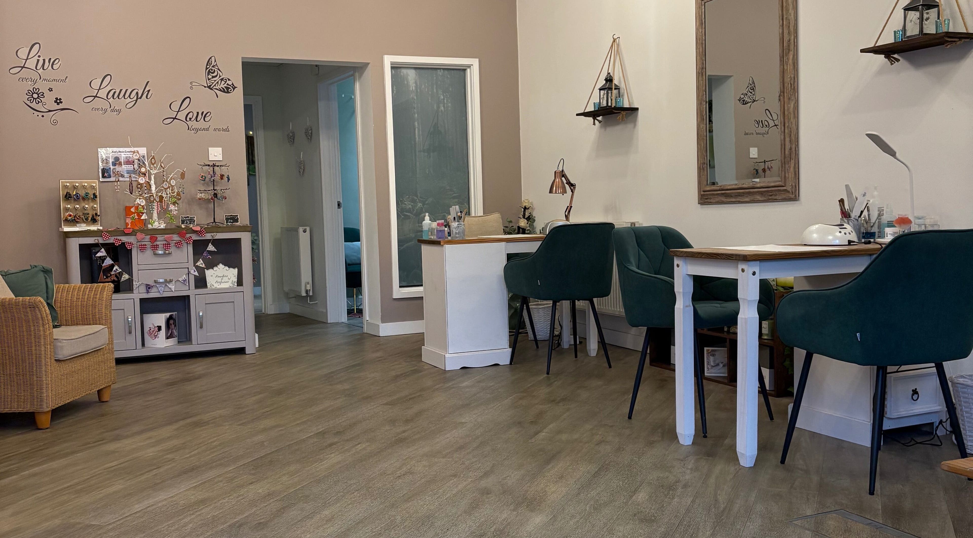 Elegant interior of Midsomer Beauty Salon Ltd in Chilcompton, England, GB, showcasing comfortable seating and decor.