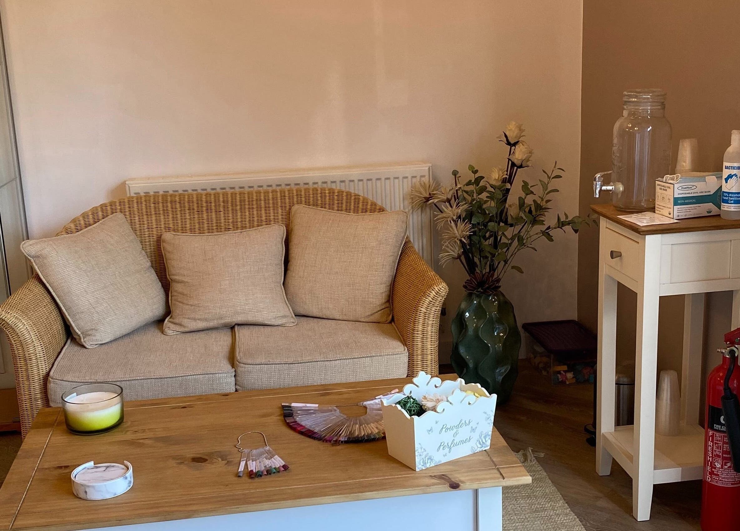 Relaxing seating area at Midsomer Beauty Salon Ltd, Chilcompton, England, GB with natural decor.