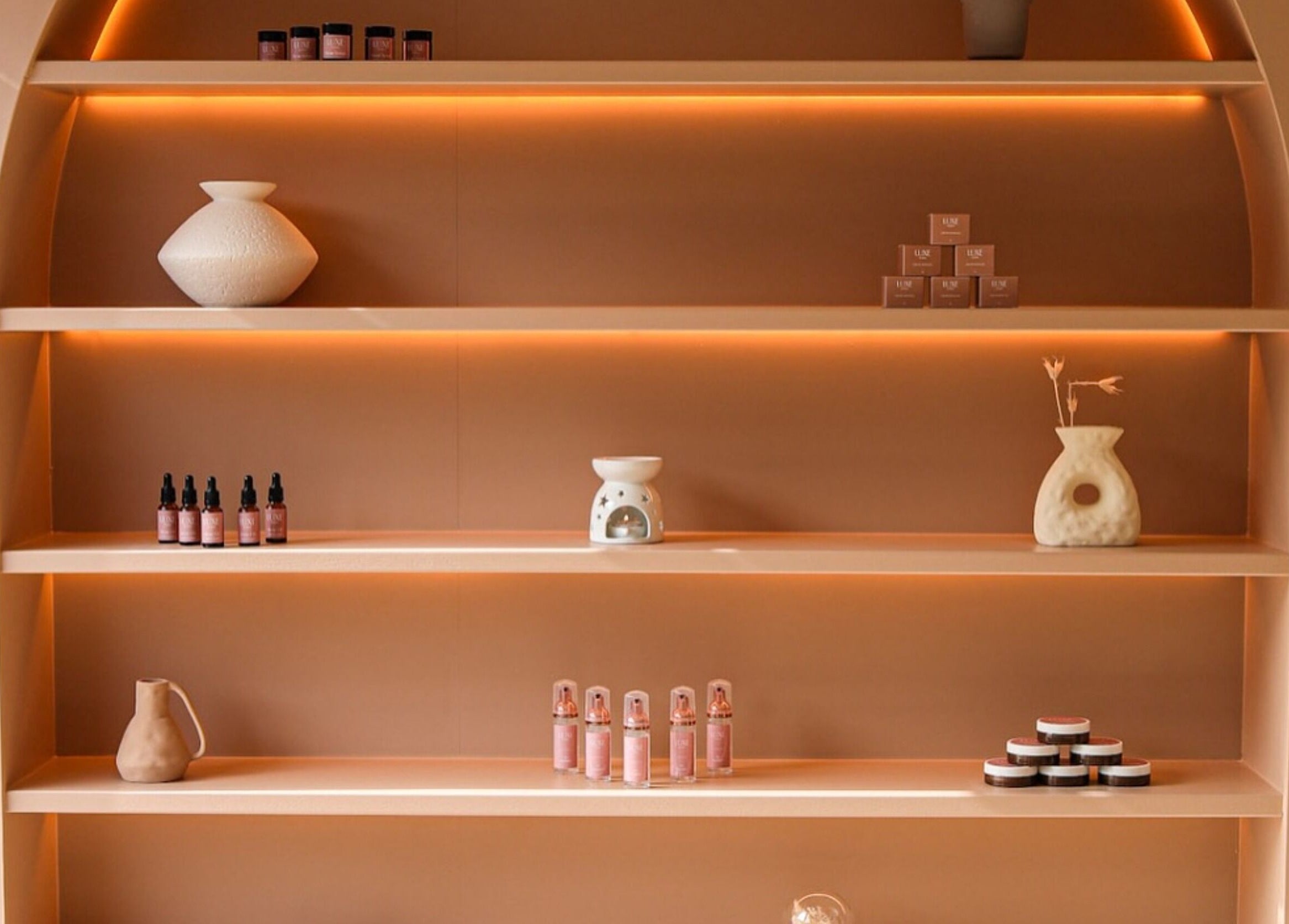 Stylish shelving at Luxe Dublin - Lash, Brow PMU Stylist, Dublin 6W, County Dublin, IE with serene ambiance and products.
