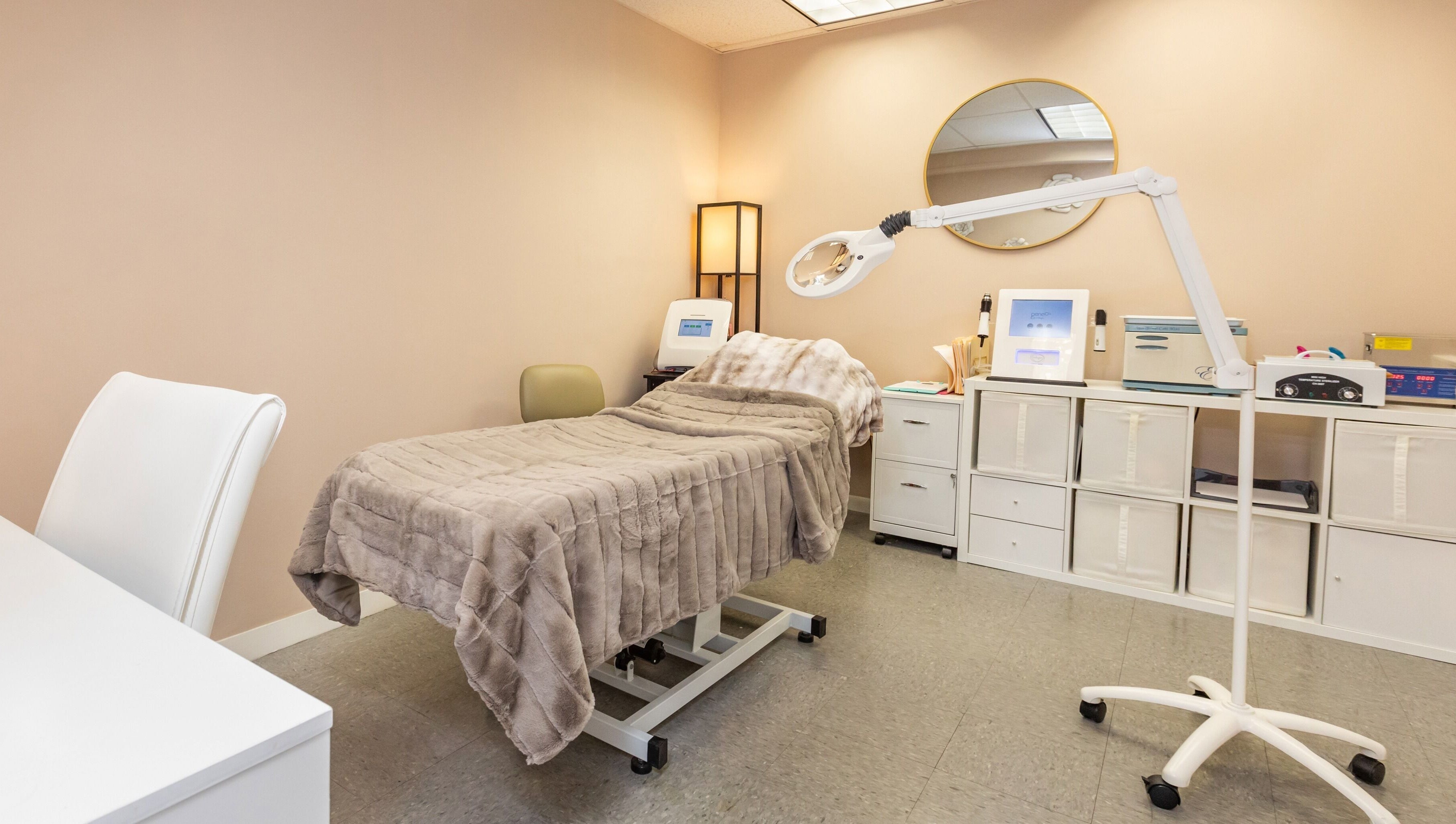 Cozy treatment bed at Lyla Beauty Bar Acton, Acton, Massachusetts, US, offering relaxing wellness services.