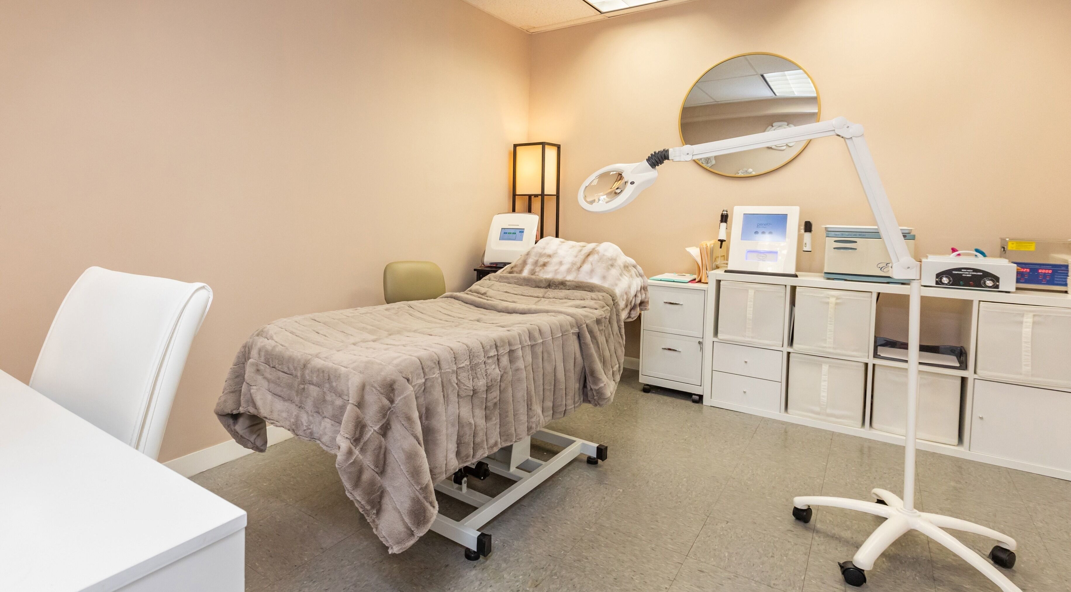 Cozy treatment bed at Lyla Beauty Bar Acton, Acton, Massachusetts, US, offering relaxing wellness services.