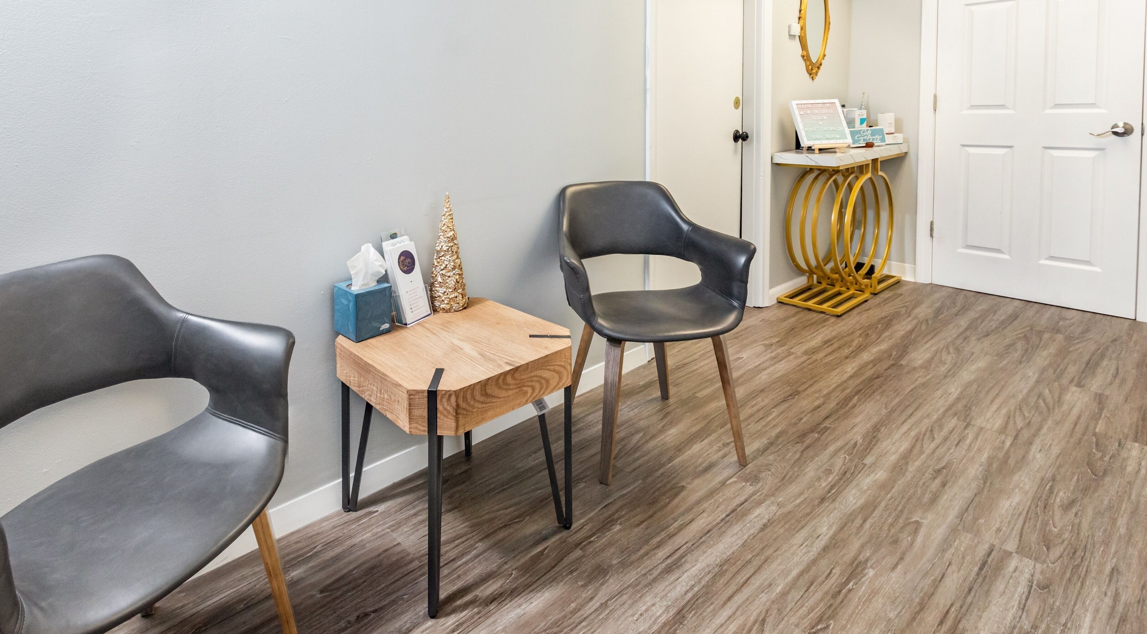 Sleek waiting area at Lyla Beauty Bar Acton in Acton, Massachusetts, US with modern chairs and decor.