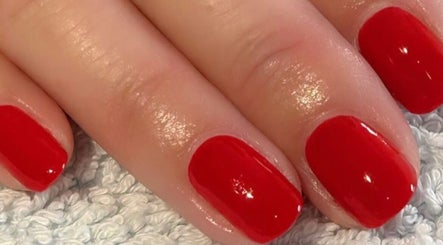 Vibrant red manicure at Polished and Pampered by Jen, Herne Bay, England, GB.