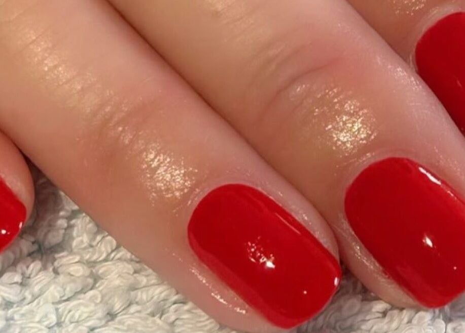 Stylish red manicure at Polished and Pampered by Jen in Herne Bay, England, GB. Elegance in every detail.