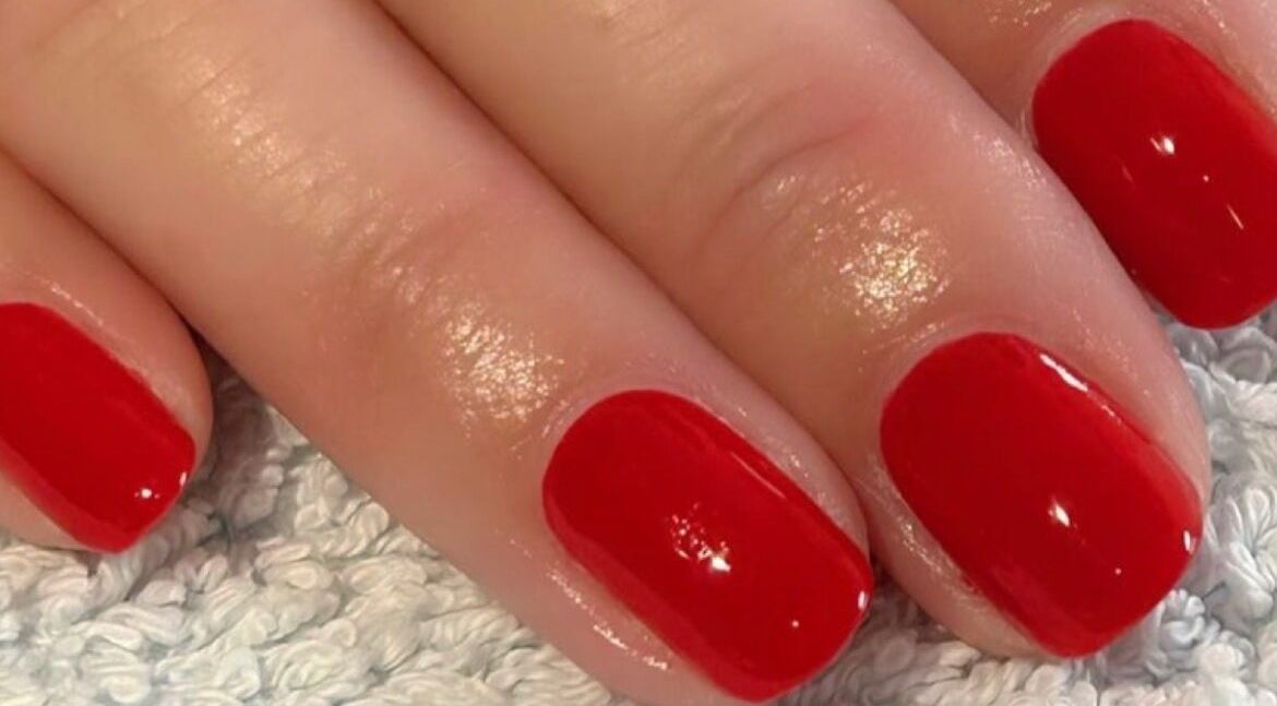 Stylish red manicure at Polished and Pampered by Jen in Herne Bay, England, GB. Elegance in every detail.