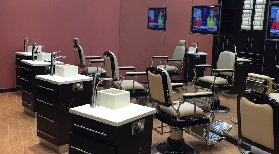 Modern salon interior with chic chairs at Gents House Salon & Spa, Dubai, AE, offering premium grooming services.