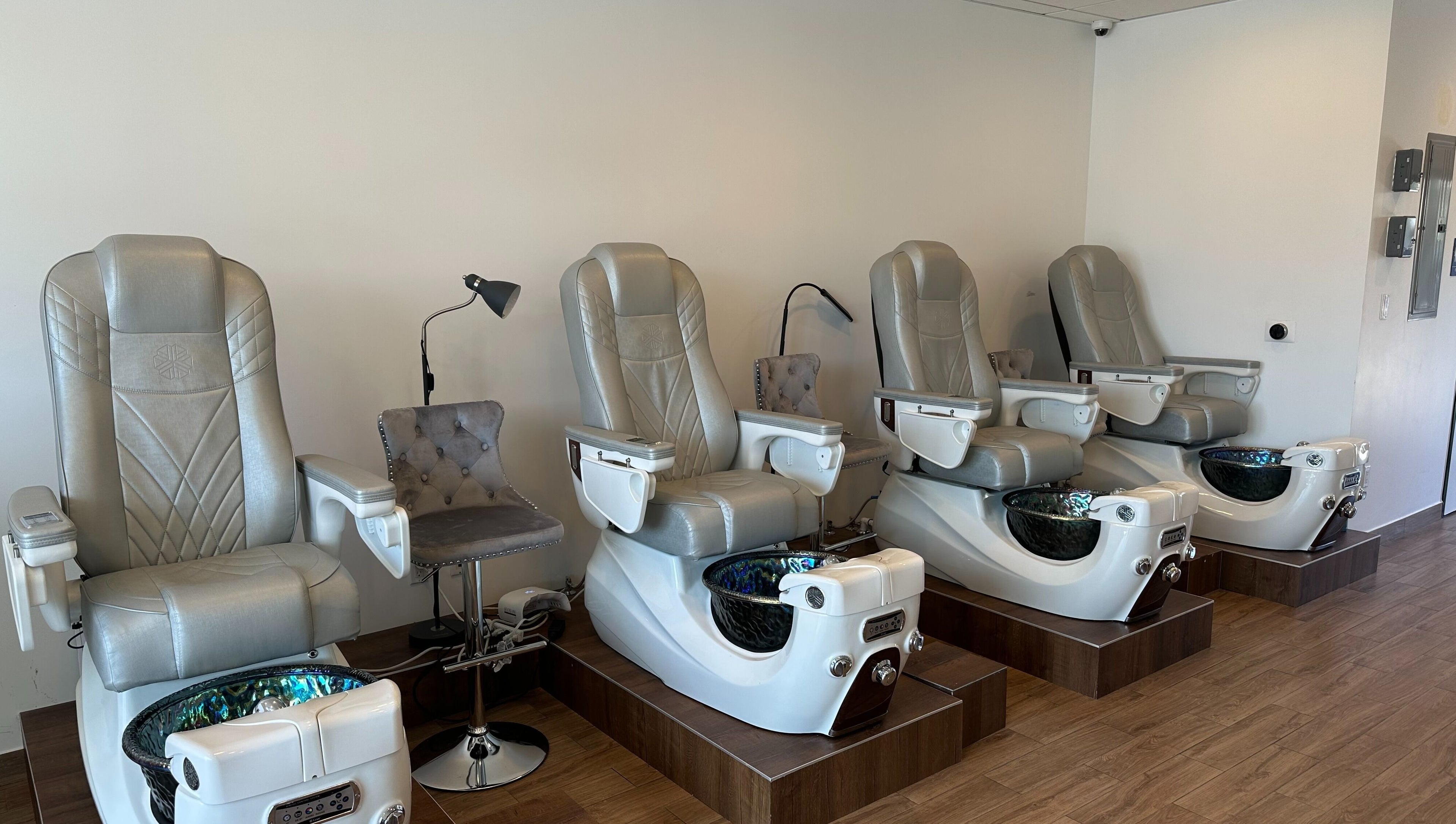 Luxurious pedicure chairs at The Nail Bar, Burbank, California, US showcasing sleek design and comfort.