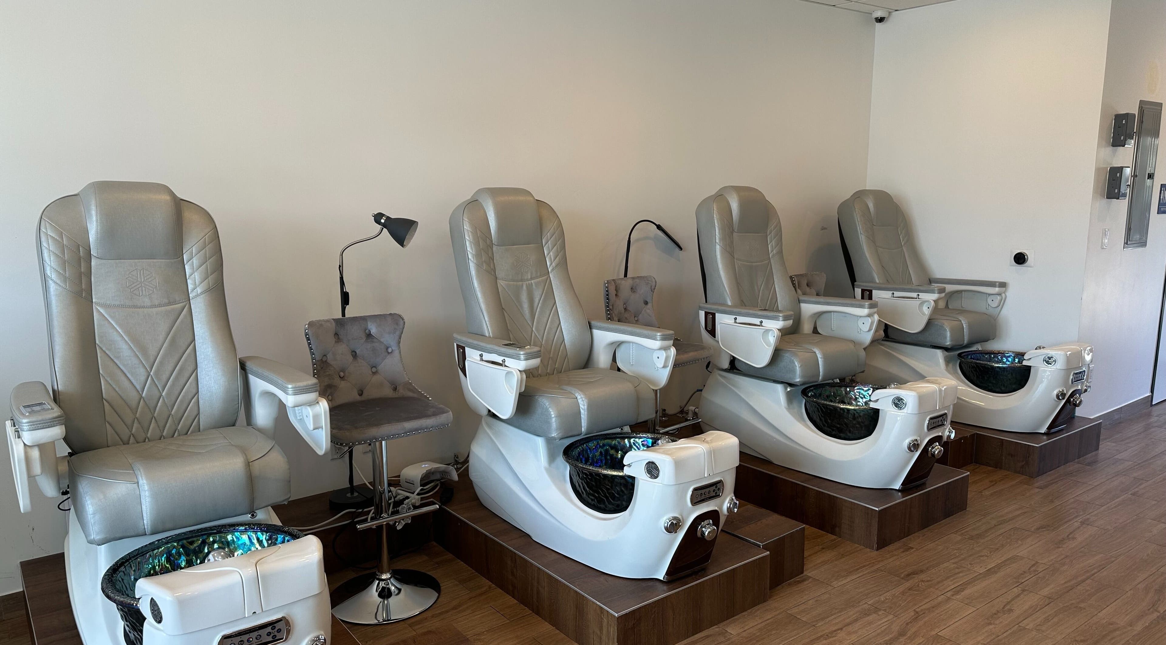 Luxurious pedicure chairs at The Nail Bar, Burbank, California, US showcasing sleek design and comfort.