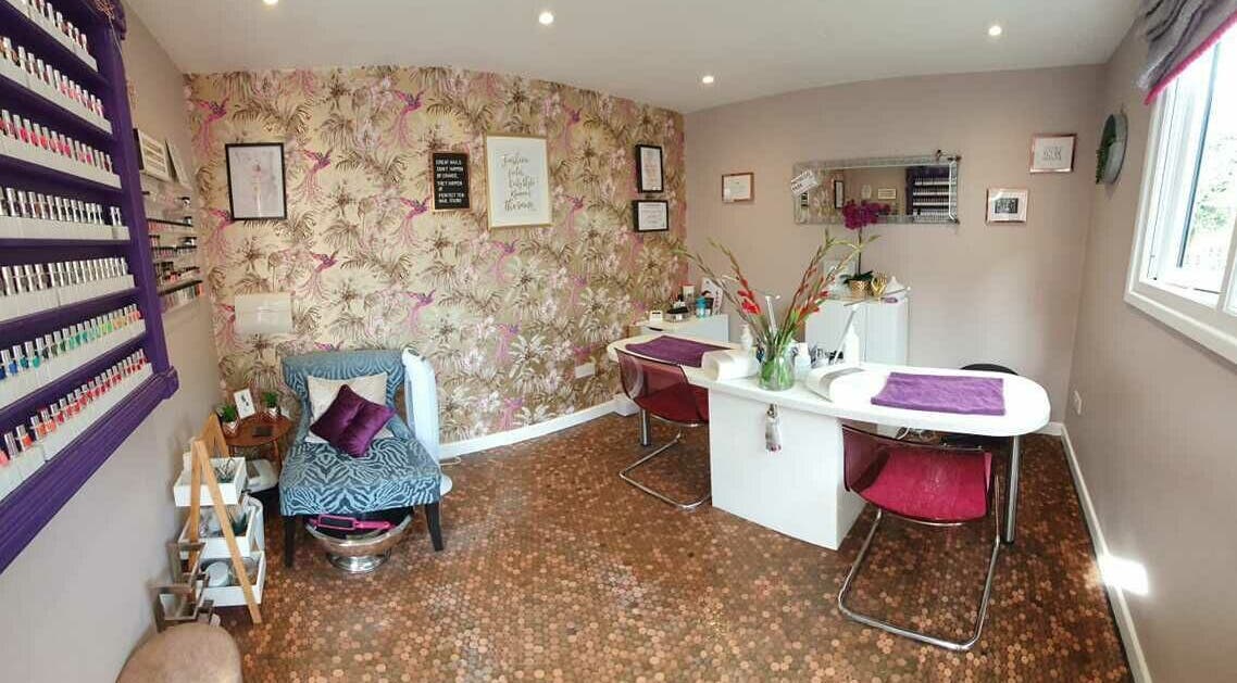 Chic interior of Perfect Ten Nail Studio in Horley, England, GB, featuring vibrant decor and nail polish display.