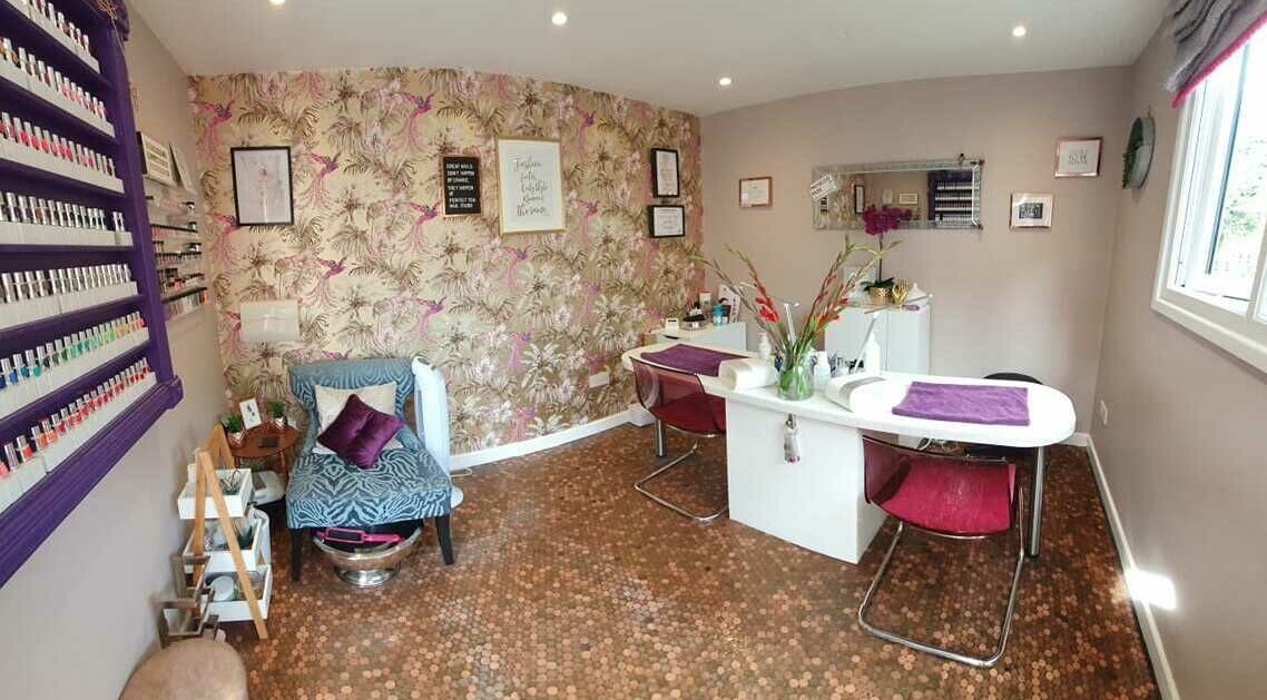 Chic interior of Perfect Ten Nail Studio in Horley, England, GB, featuring vibrant decor and nail polish display.