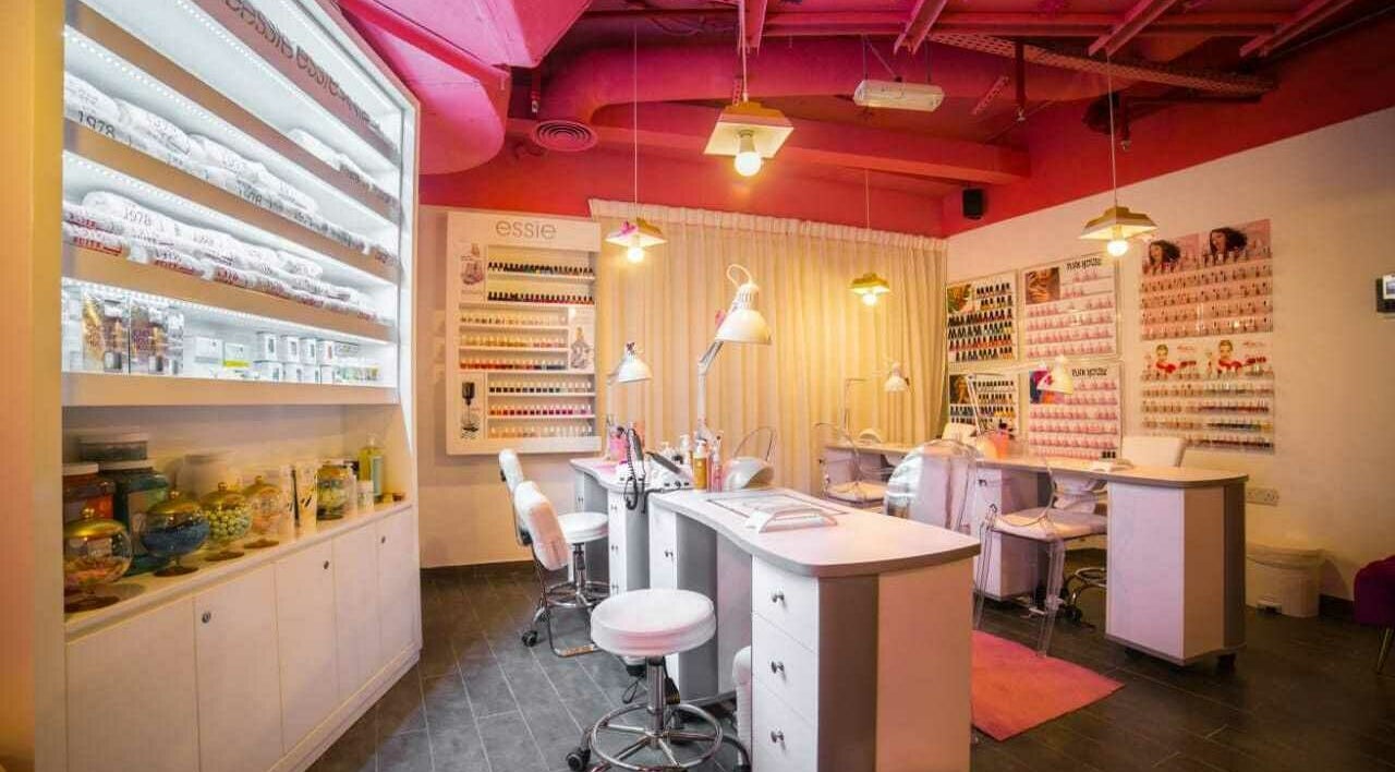 Nail salon interior at The 1978 Suite, Dubai, Dubai, AE with vibrant decor and personalized stations.