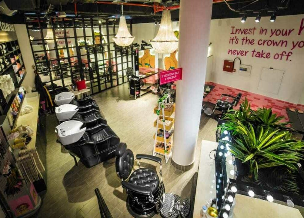 Modern salon interior with chic decor at The 1978 Suite, Dubai, Dubai, AE showcasing stylish hair stations.