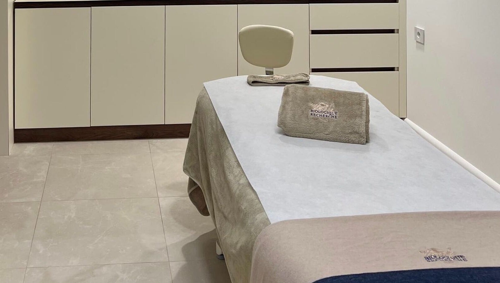 Tranquil treatment room at Advanced Aesthetics, Birkenhead, England, GB, showcasing modern elegance.