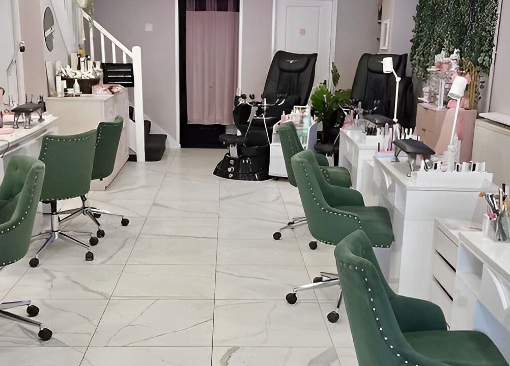 Interior of Kaycie Kyle Brislington Salon showcasing stylish green chairs in Bristol, England, GB.