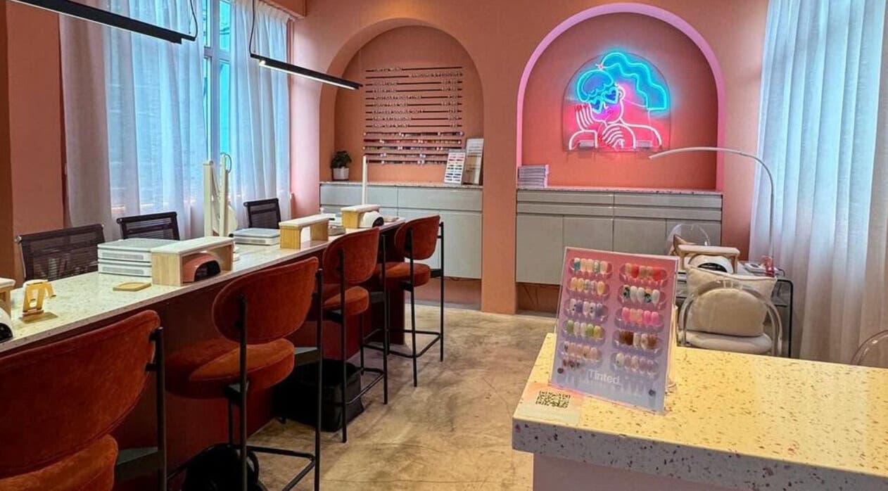 Modern salon interior at Tinted. - Causeway Bay, Hong Kong Island, HK, with pink hues and neon art.