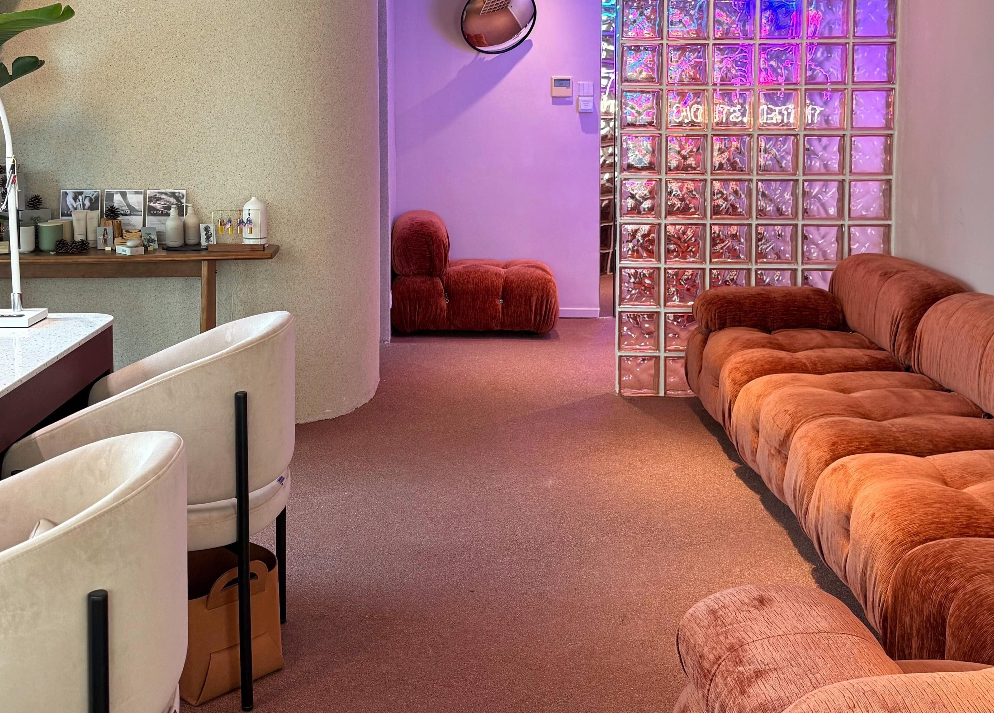 Chic lounge at Tinted. Studio - Tsim Sha Tsui, Kowloon, Kowloon, HK with plush seating and ambient lighting.