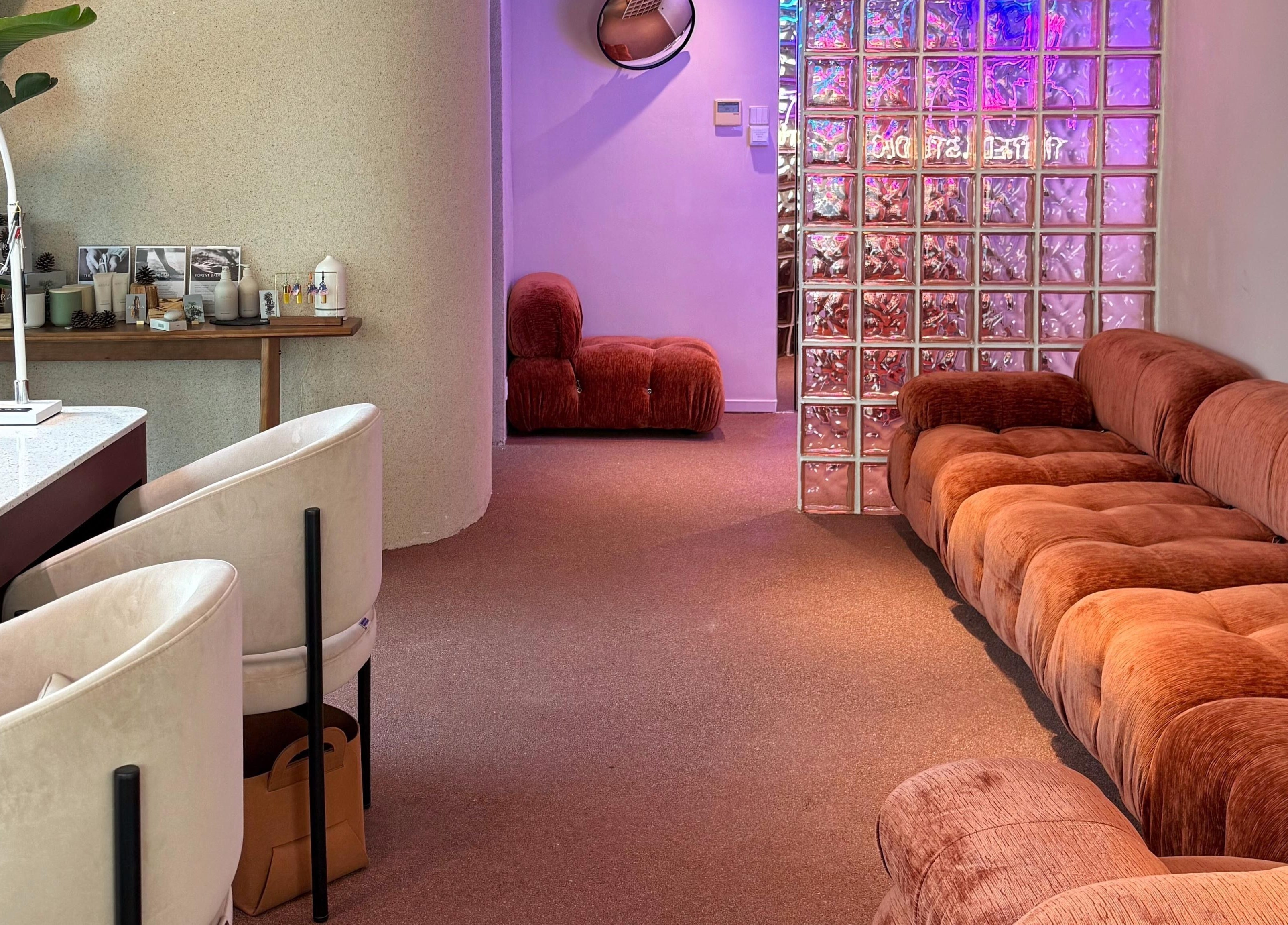 Chic lounge at Tinted. Studio - Tsim Sha Tsui, Kowloon, Kowloon, HK with plush seating and ambient lighting.