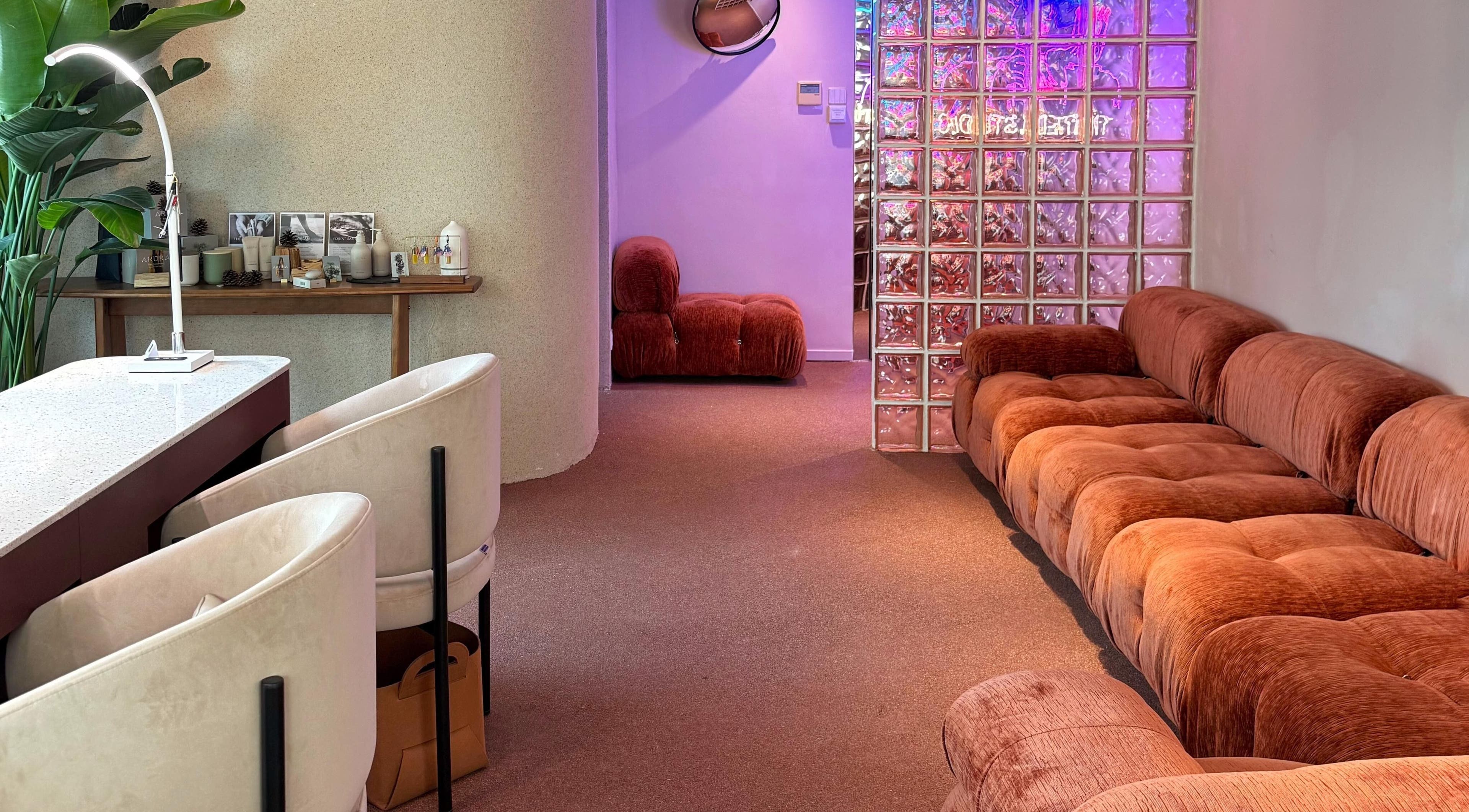 Chic lounge at Tinted. Studio - Tsim Sha Tsui, Kowloon, Kowloon, HK with plush seating and ambient lighting.