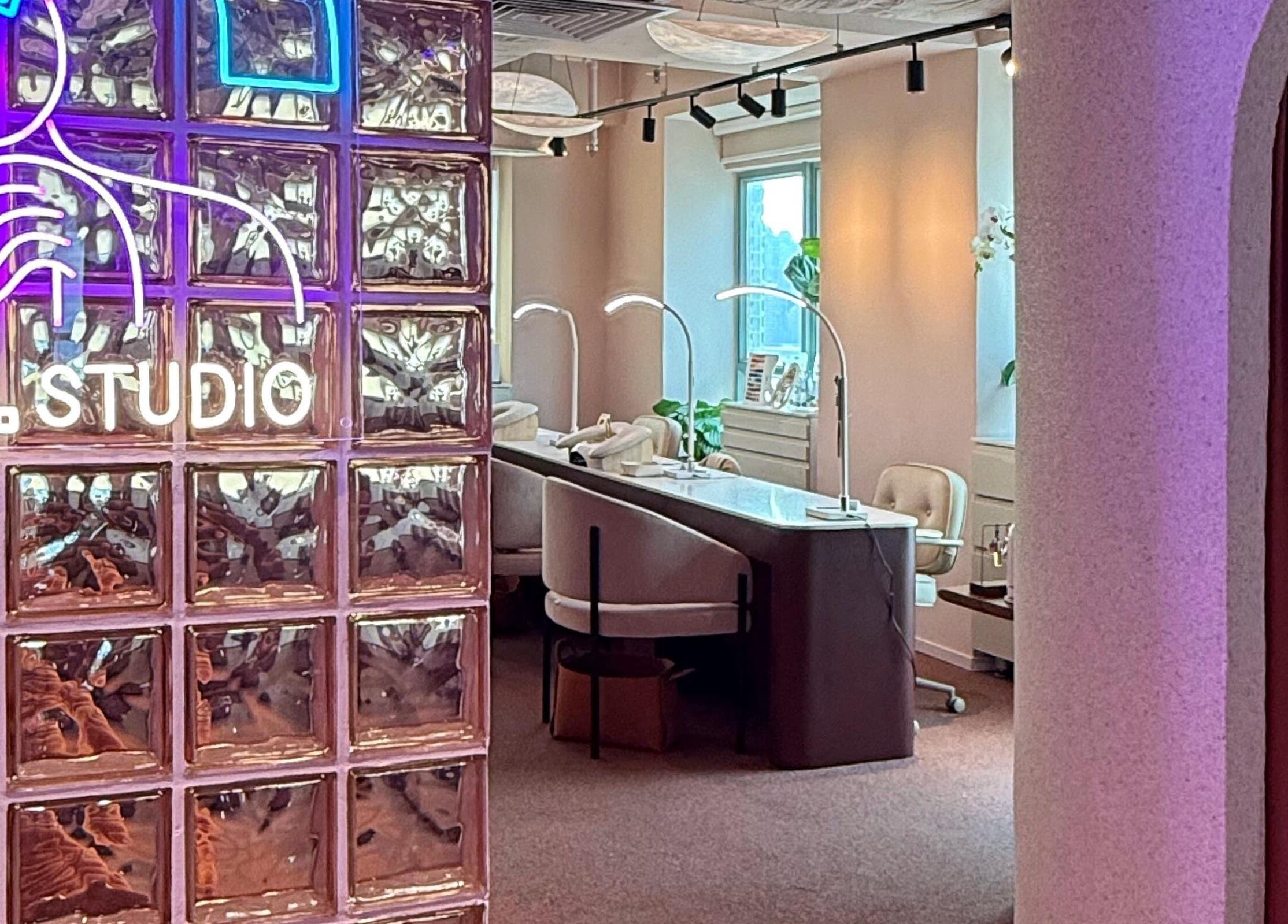 Chic interior of Tinted. Studio - Tsim Sha Tsui with neon art, glass blocks in Kowloon, Kowloon, HK.