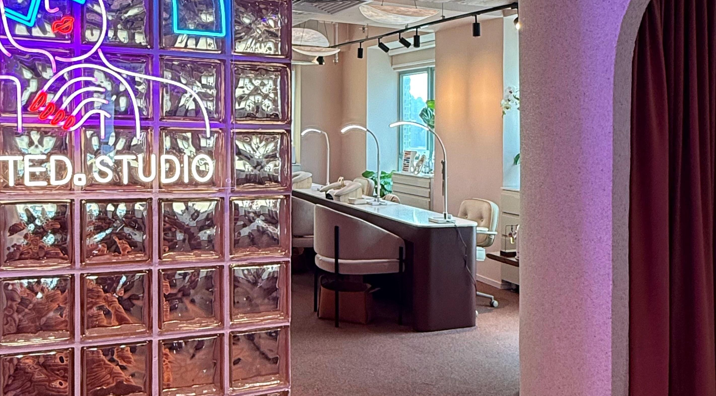 Chic interior of Tinted. Studio - Tsim Sha Tsui with neon art, glass blocks in Kowloon, Kowloon, HK.
