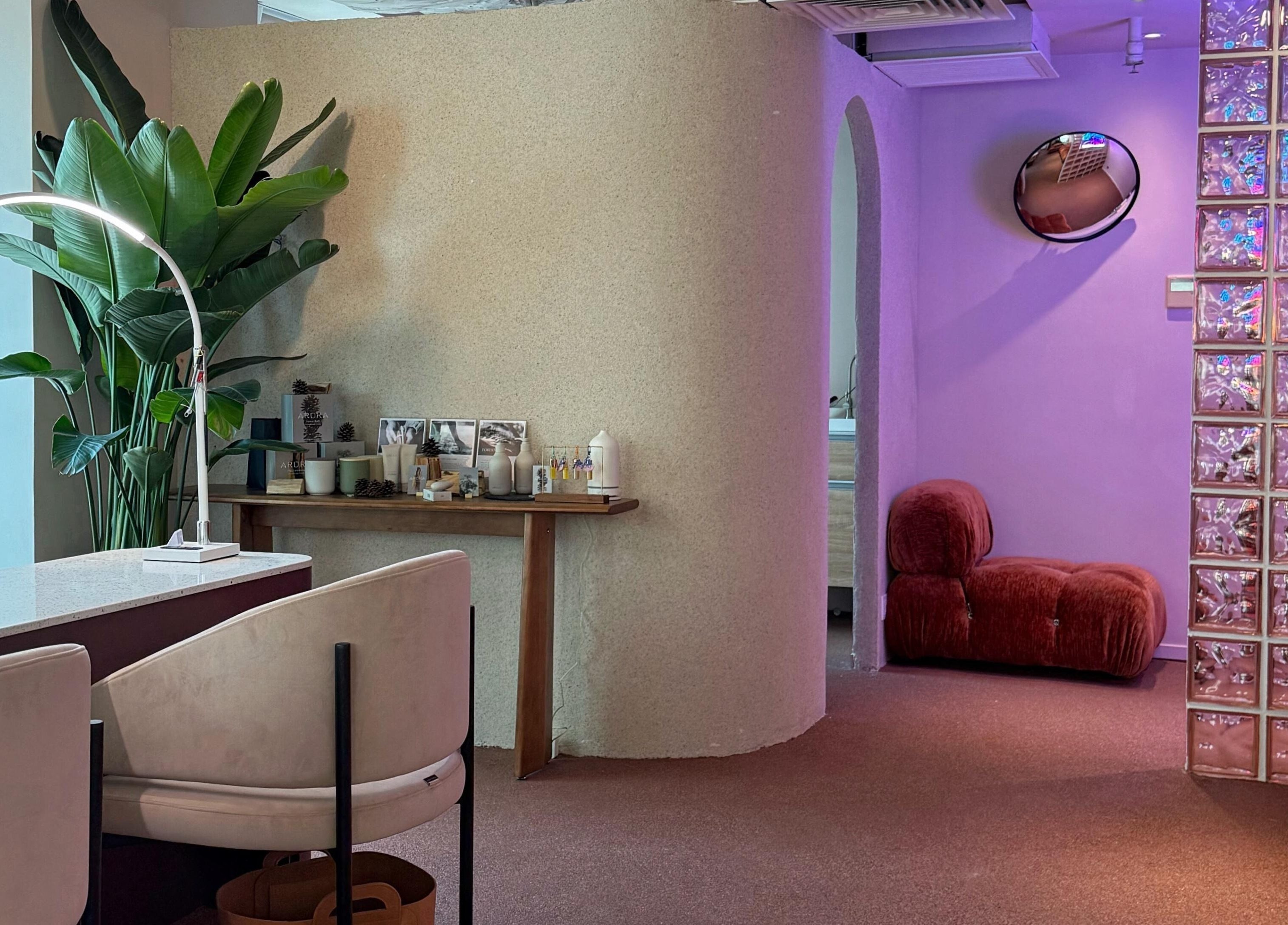 Modern interior of Tinted. Studio - Tsim Sha Tsui, Kowloon, HK featuring cozy seating and plants.