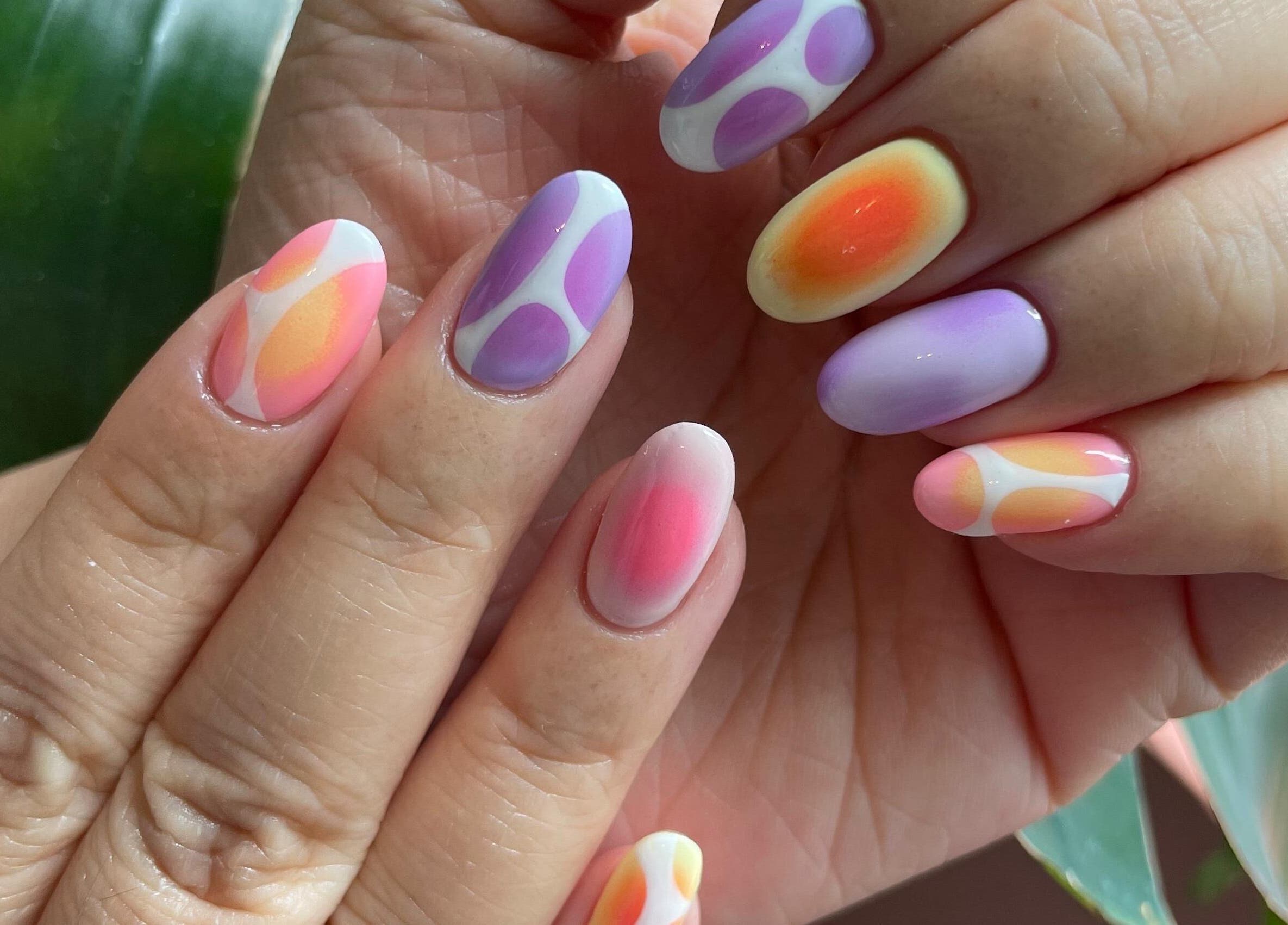 Colorful nail art at Tinted. Studio - Tsim Sha Tsui, Kowloon, Kowloon, HK featuring pink and purple designs.