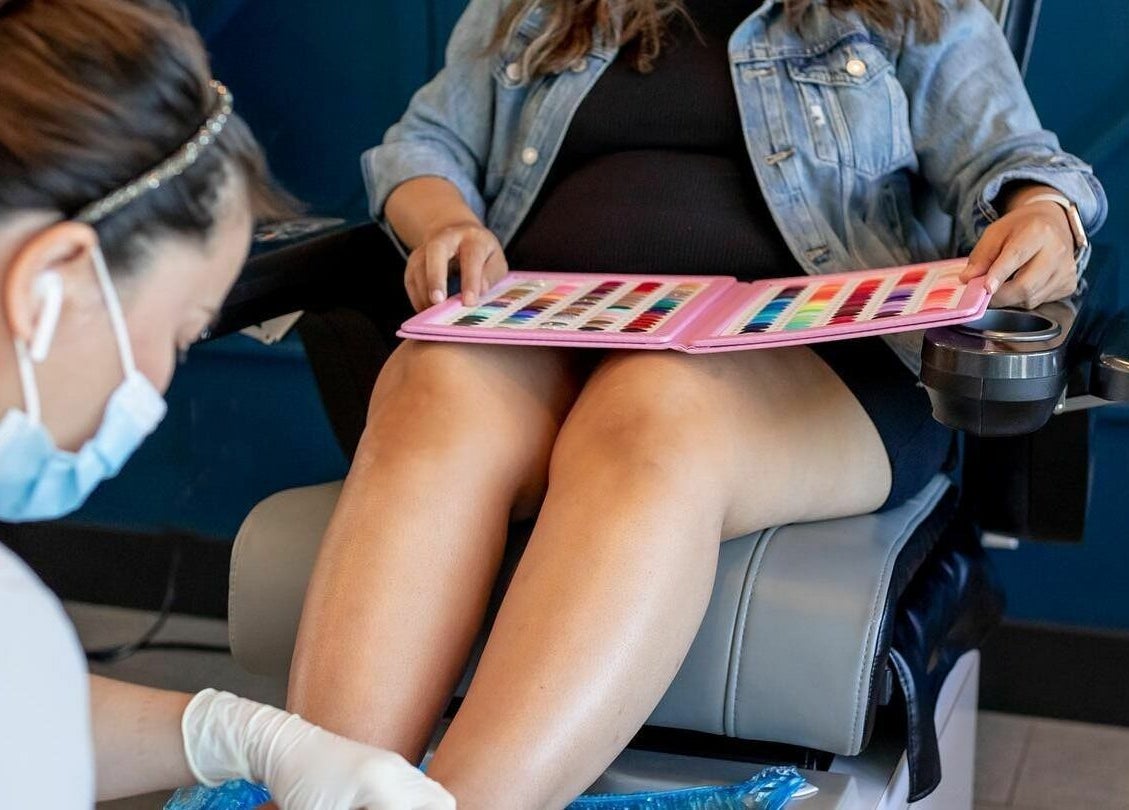 Pedicure service at Nirvana Beauty Lounge, Reno, Nevada, US with nail color selection.