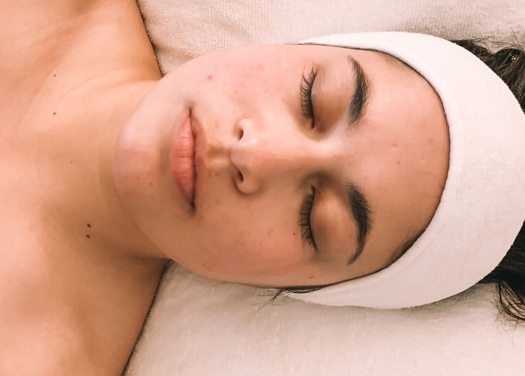 Relaxing facial treatment at Oura Day Spa in Gisborne, Gisborne, NZ, featuring a calm and peaceful atmosphere.