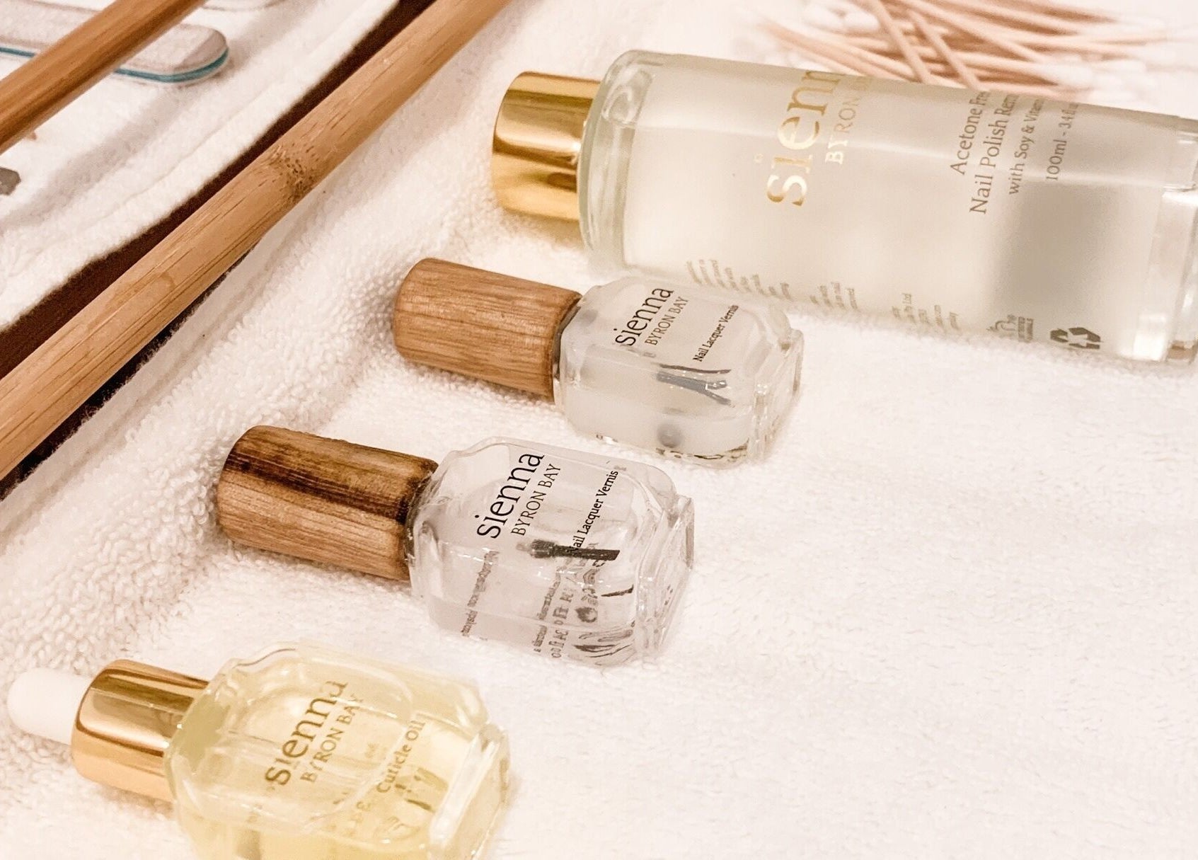 Oura Day Spa in Gisborne, Gisborne, NZ showcases natural nail care products beautifully arranged on a plush towel.