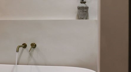 Elegant bathroom at Recovery by Oura, Gisborne, NZ showcasing minimalist design with soothing beige tones.