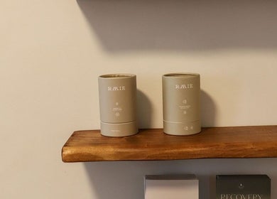 Elegant wooden shelf with wellness products at Recovery by Oura, Gisborne, Gisborne, NZ.