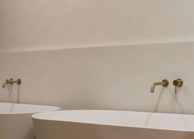Elegant twin spa tubs at Recovery by Oura in Gisborne, Gisborne, NZ, offering a serene relaxation space.