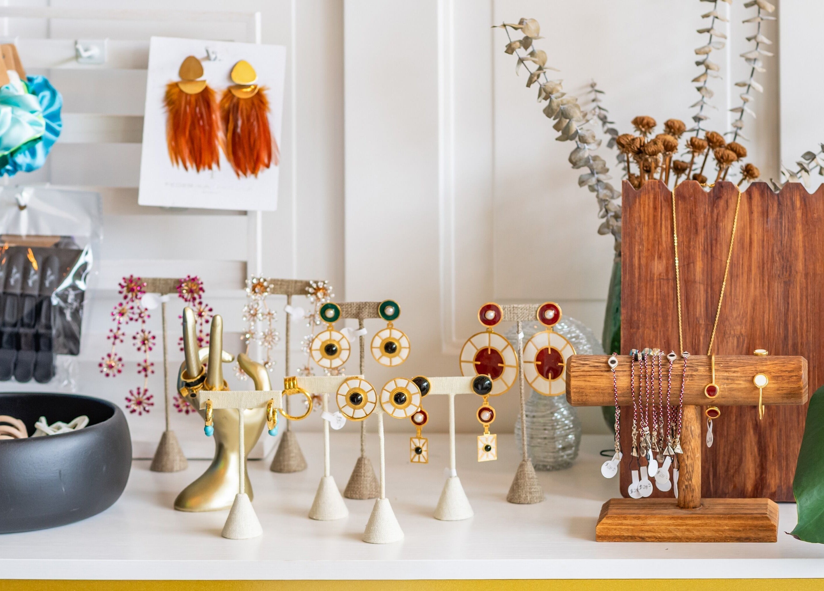 Jewelry and accessories at The Alma Project by AG in Boca Raton, Florida, US beautifully displayed on stylish stands.