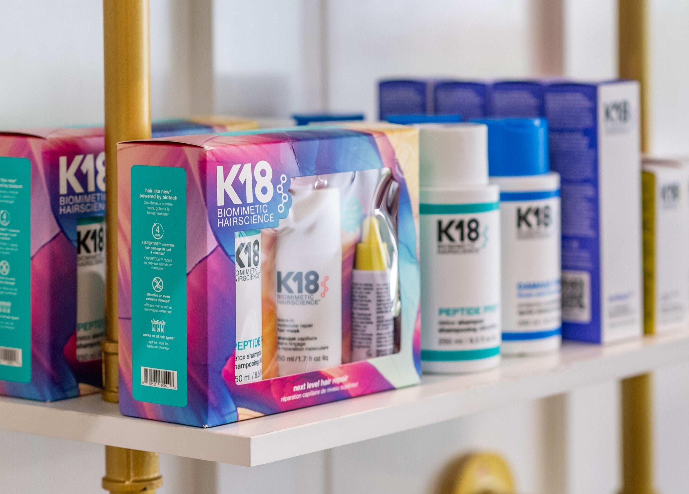 K18 haircare products on display at The Alma Project by AG, Boca Raton, Florida, US, offering advanced biomimetic solutions.