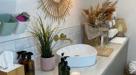 Elegant washroom setup at Beauty + Wellness by Faye Jervis, Sheffield, England, GB with natural decor and soothing accents.