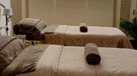 Relaxing treatment beds at Rolia Day Spa Ondangwa, Ondangwa, Oshana Region, NA, inviting tranquility and luxury.