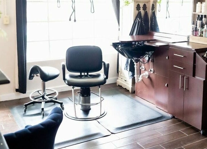 Modern styling chair and sink at Hair Loft on Linden, Pinehurst, North Carolina, US. Bright and inviting space.