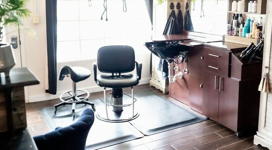 Modern styling chair and sink at Hair Loft on Linden, Pinehurst, North Carolina, US. Bright and inviting space.