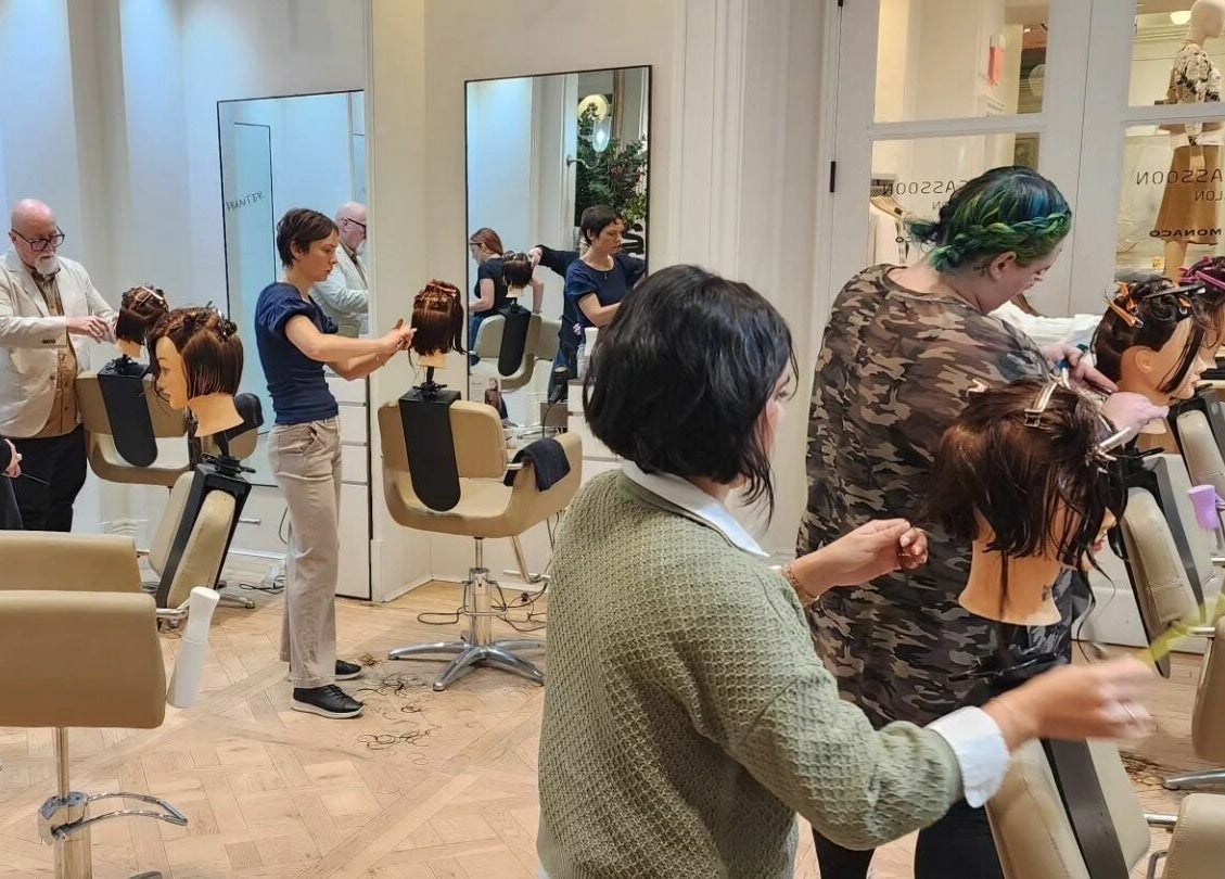 Stylists practicing hair techniques at Hair Loft on Linden, Pinehurst, North Carolina, US.